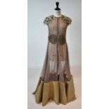 RIDHI MEHRA; a nude silk and taffeta full length evening dress with embellished shoulders and beaded