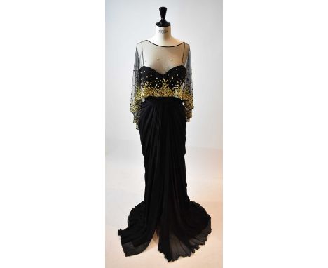 ZUHAIR MURAD; a black 100% silk full length strapless evening dress with gold beaded lace cape, size small.