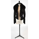 GIVENCHY; a black wool short fitted jacket with detachable fur trim, size small.