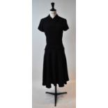 YVES ST LAURENT; a black wool crepe short sleeve dress, size small.
