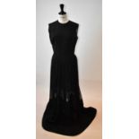 ELIE SAAB; a black wool and silk full length evening dress embellished with sequins, size 40.