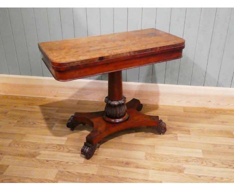 A William IV mahogany fold over card table, on lappet carved pedestal to platform base, 90.5 cm W