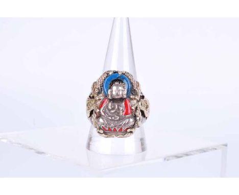 An early to mid-19th century Buddhist devotional ring in white an yellow metal, with seated Buddha with blue nephrite halo an