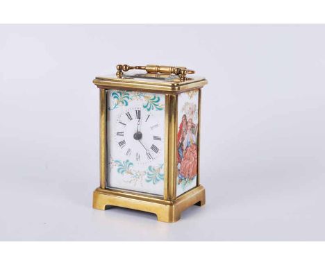 A mid to late 20th century brass carriage clock, with Roman dial and with  printed enamel panels displaying a courting couple