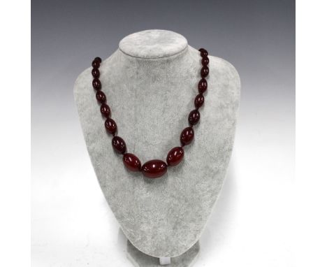 A graduated strand of vintage cherry amber beads, largest bead approx 2.8cm, approx 61.6g 