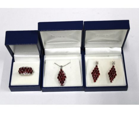 9ct white gold parure comprising a ruby and diamond dress ring, drop earrings and pendant necklace by Rocks &amp; Co (3) 