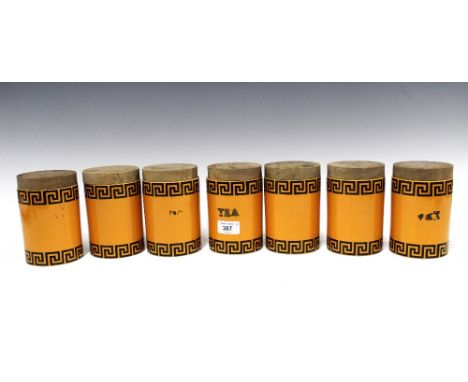 Set of seven vintage Portmeirion canisters designed by Susan Williams-Ellis, with greek key borders and wooden covers (7) 