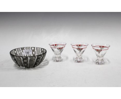 Venetian glass bowl with black spiral pattern, 14cm diameter,  and a set of three Art Deco glasses with red and black enamel 