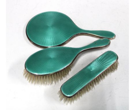 George V silver and enamel dressing table brush set comprising hand mirror, hair brush and clothes brush, Birmingham 1929 (3)