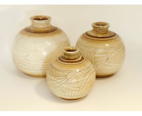 CELTIC POTTERY. Three buff Medallion design Celtic Pottery, Newlyn globular vases. Largest height 19cm. Condition: Good. No d