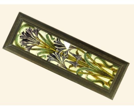 SHERWIN'S TILES. A Sherwins Patent four tile panel showing agapanthus blossoms (one tile corner missing). Oak frame. 69 x 23c