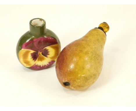 SCENT BOTTLES. A ceramic pansy scent bottle, the base numbered Rd.1878169 (lacks stopper). Also, a 19th century painted pear 