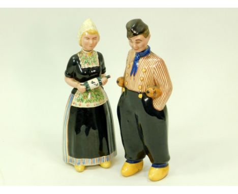 BOLS DECANTERS. A pair of Dutch ceramic figural decanters for Bols. Height 27cm. WE CAN SHIP THIS LOT, but NOT if part of a l