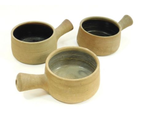 LEACH POTTERY. Three Leach Pottery Standard Ware single-handle casseroles. Length 22cm. Condition: No damage or restoration b