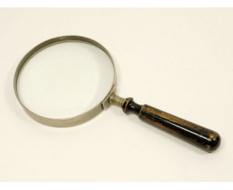 MAGNIFYING GLASS. A large magnifying glass with turned ebonised handle. Diameter of lens 12.5cm. WE CAN SHIP THIS LOT, but NO