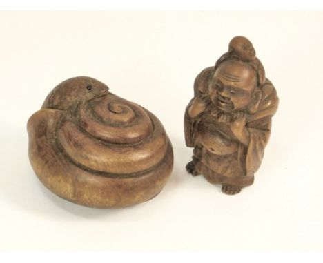 NETSUKE. Two early 20th century carved wooden netsuke: a snail in its shell & a standing figure.  WE CAN SHIP THIS LOT, but N