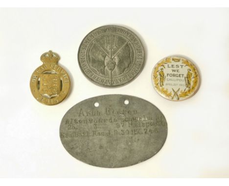 WWI MEDAL, IDENTITY DISC & BADGES. A Spink & Sons, Battle of Jutland commemorative medal; a German army WWI identity disc, a 