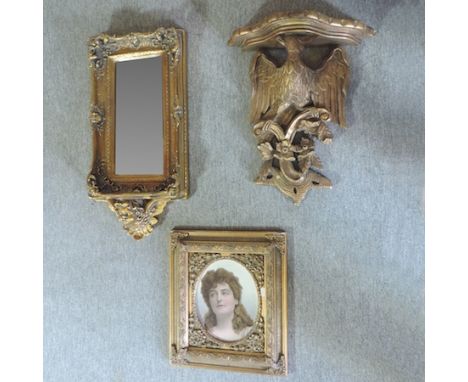 A gilt painted wall bracket, in the form of an eagle, 51cm tall, together with a gilt framed wall mirror and a Victorian styl
