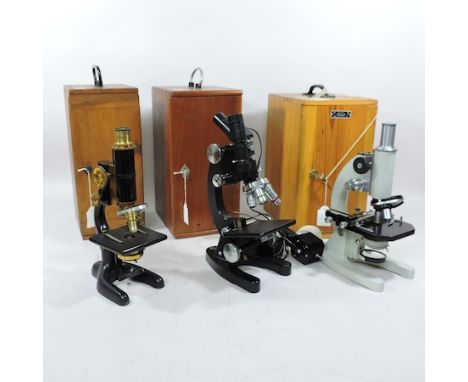 A 20th century microscope, by Bausch and Lomb, in a fitted case, together with two others 