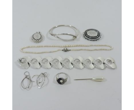 A silver bangle, with hammer beaten decoration, a modern Danish silver bracelet, a locket, an Art Deco ring, pearl necklace, 