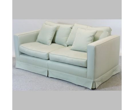 A modern turquoise upholstered two seater sofa, with loose cushions, 180cm
