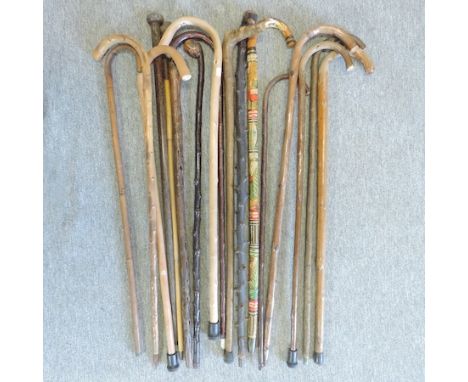 A collection of mainly mid 20th century walking sticks, to include a 19th century partridge wood stick, and a collection of h