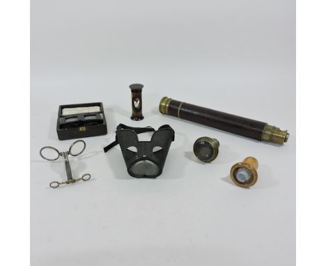 A collection of optical instruments, to include a two multiple viewers, a folding opera glass with compass, 'La Parisienne', 