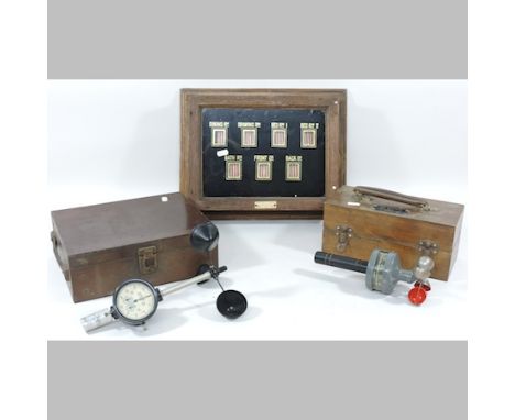 A hand anemometer, cased, together with another, and an early 20th century glass cased electric servants bell