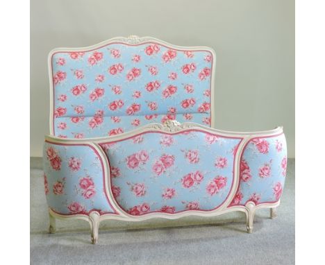 A cream painted French Cath Kidston upholstered double bedstead, 150cm, together with a pair of matching curtains