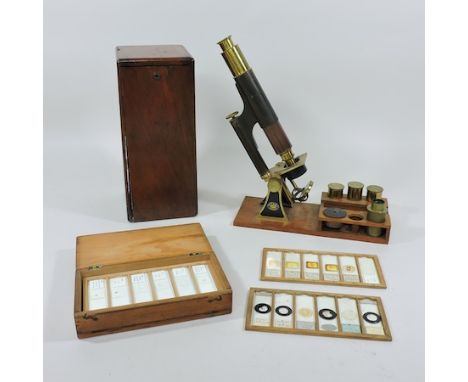 An early 20th century brass and black painted microscope, by Smith and Beck, London, no. 2177, in a fitted mahogany case, tog