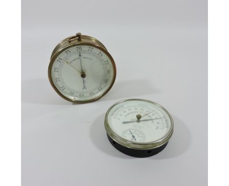 A brass cased barometer, 14cm tall, together with a hydrometer and a collection of leather bound books