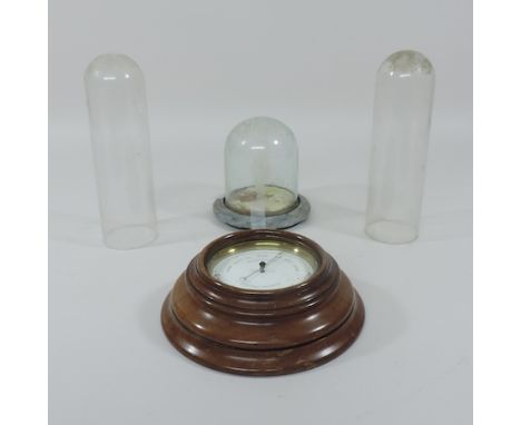 A collection of three glass domes, tallest 24cm, together with a barometer and two 17th century carved panels, each 114cm lon