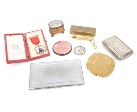 A collection of 19th and 20th century Ladies curios. The collection to include a two silver tone metal cigarette cases, a sma