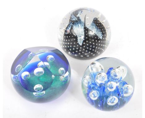 Collection of three glass paperweights. Including Caithness Cauldron, Scotland, Chorale collector's edition weight 78/1000 an