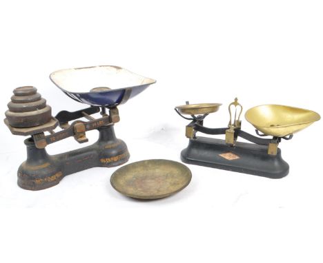 A pair of early 20th century ebonised cast metal grocers shop scales by Ashworth and Preston &amp; Thomas - Bristol. Both sca