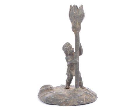 A late 19th / early 20th century pewter 'Cecily Barker' style candlestick holder. Small boy / girl holding an oversized tulip
