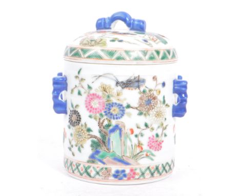 An early 20th century circa 1920s Chinese porcelain tea caddy. The caddy having a white ground, with four blue shaped handles