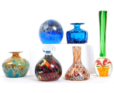 An assortment of vintage studio art glass vases and paperweights. Comprising of two mdina squat bulbous glass vase - one in a