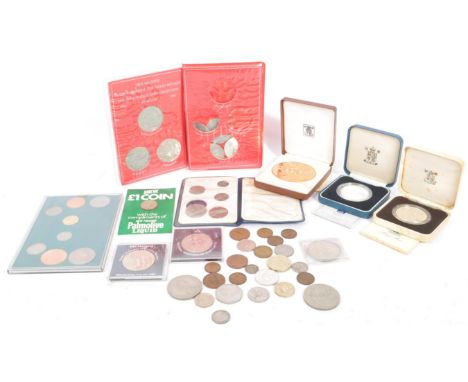 An assortment of UK proof and non-proof coins &amp; sets. The lot to include a 90th Birthday Silver Proof Crown coin with cer