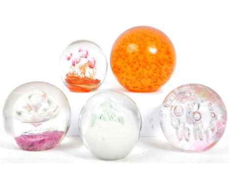 An assortment of five mid century / vintage studio art glass paperweights. Comprising of multi coloured and varying controlle