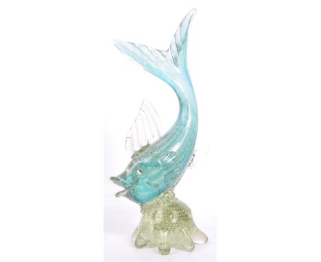 A mid 20th century Murano studio art glass fish. The fish resting atop a glass form in the manner of a sea anemone. The fish 