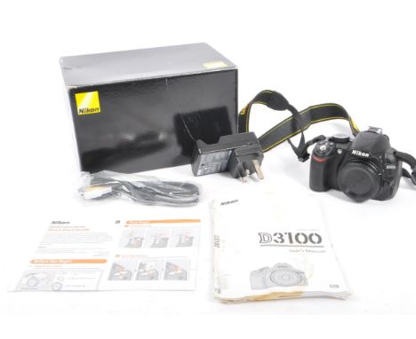 Nikon - A contemporary circa 2010/11 Nikon D3100 digital SLR camera body. The camera in manufacturer refurbished box, with ch