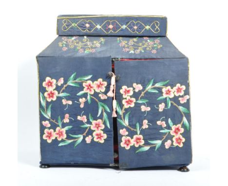 A 1920s Chinese embroidered twin swing door sewing box. Having independant lidded box atop, embroidered floral scrolled exter