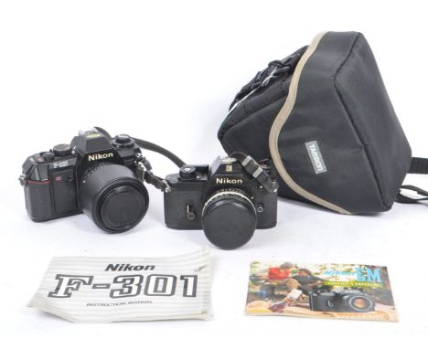 Nikon - Two 20th century 35mm SLR film cameras. The lot consisting of a Nikon EM 35mm SLR camera with Nikon Series E 50mm F1.