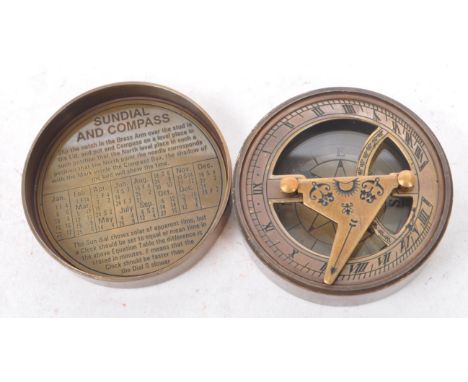 A contemporary brass cased compass and sundial. The lid of the case being inscribe 'The Mary Rose, London 1511-1545'. Weight 
