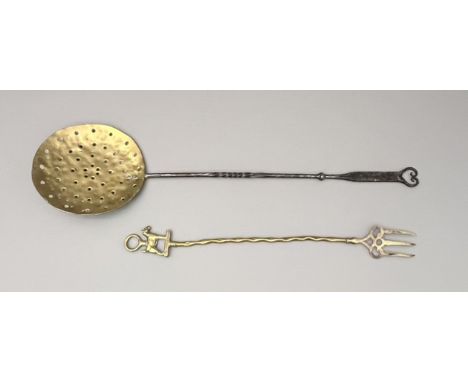 An antique brass and wrought iron cream skimmer - 72cm long; together with a brass toasting fork with Wire Haired Terrier ter