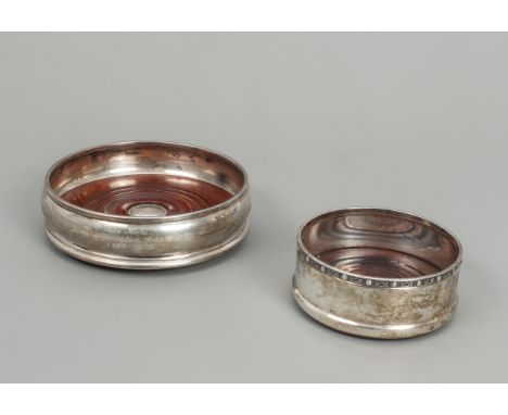 Two Elizabeth II silver wine coasters - one of bombe form, Harrison Brothers &amp; Howson Ltd, London 2000, 13.2cm diameter; 