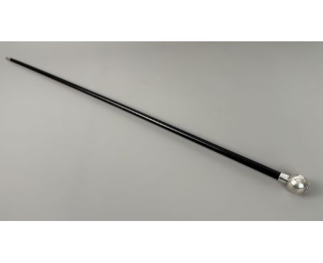A black wooden swagger stick with hallmarked silver top, London 1922.
