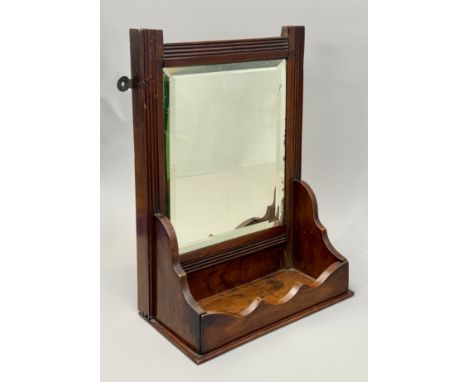 A walnut hanging mirror with comb shelf - c.1900, possibly American, the rectangular bevelled plate within a reeded frame, th