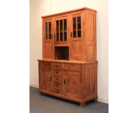 An early 20th century style cherry wood dresser - the upper section with a central glazed door enclosing a single shelf over 